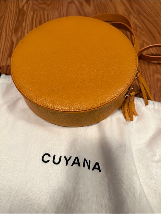 Cuyana Handbags - Cuyana Mustard Leather Round Crossbody with Tassel
